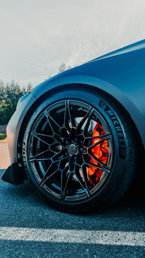 Painted brake caliper on a customized vehicle at SB Auto Studio